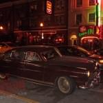 The Hudson arrives outside the museum, with a view of Broadway's lights in the background