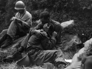 A soldier comforts a comrade